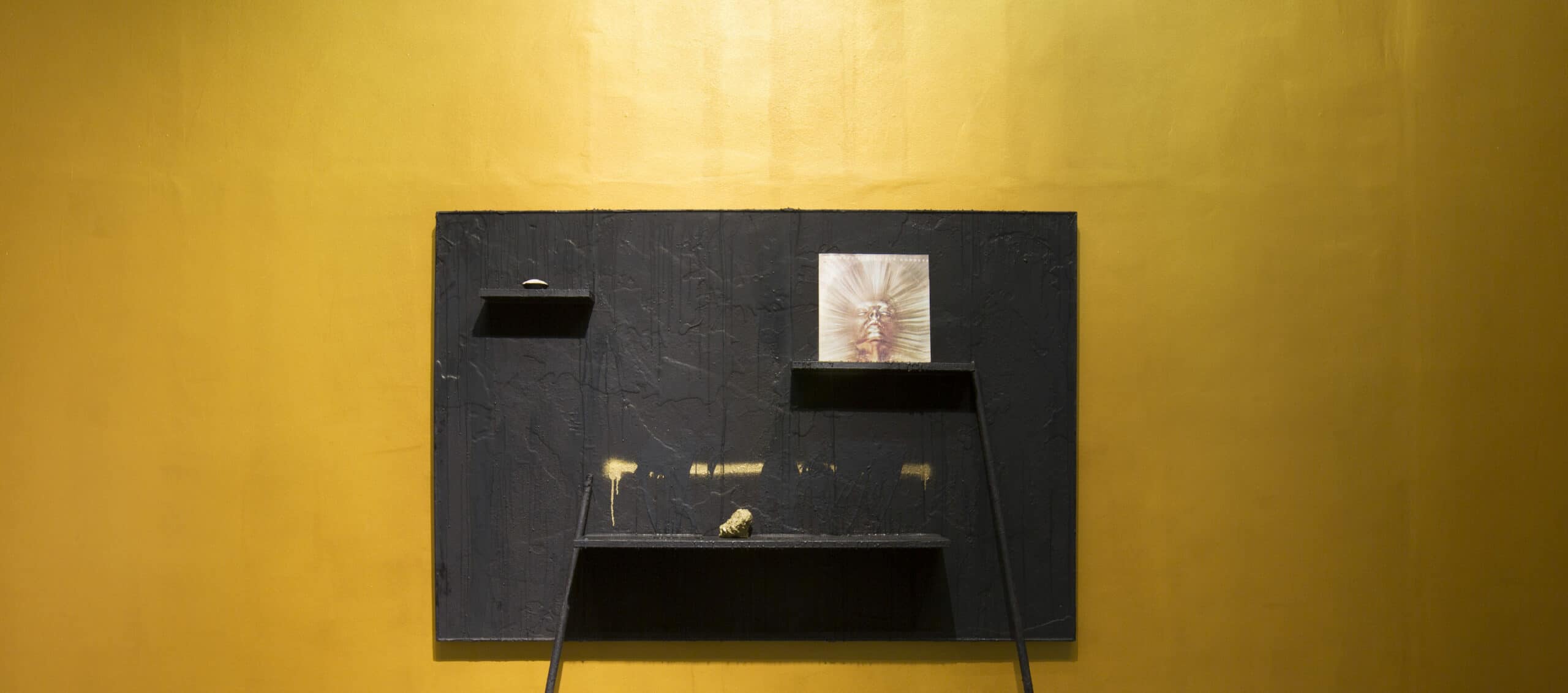 Rashid Johnson. The Sunshine. 2011. Wax, black soap, vinyl, space rock, wood, and shea butter. 121.92 x 182.88 x 24.77 cm. Installation view.