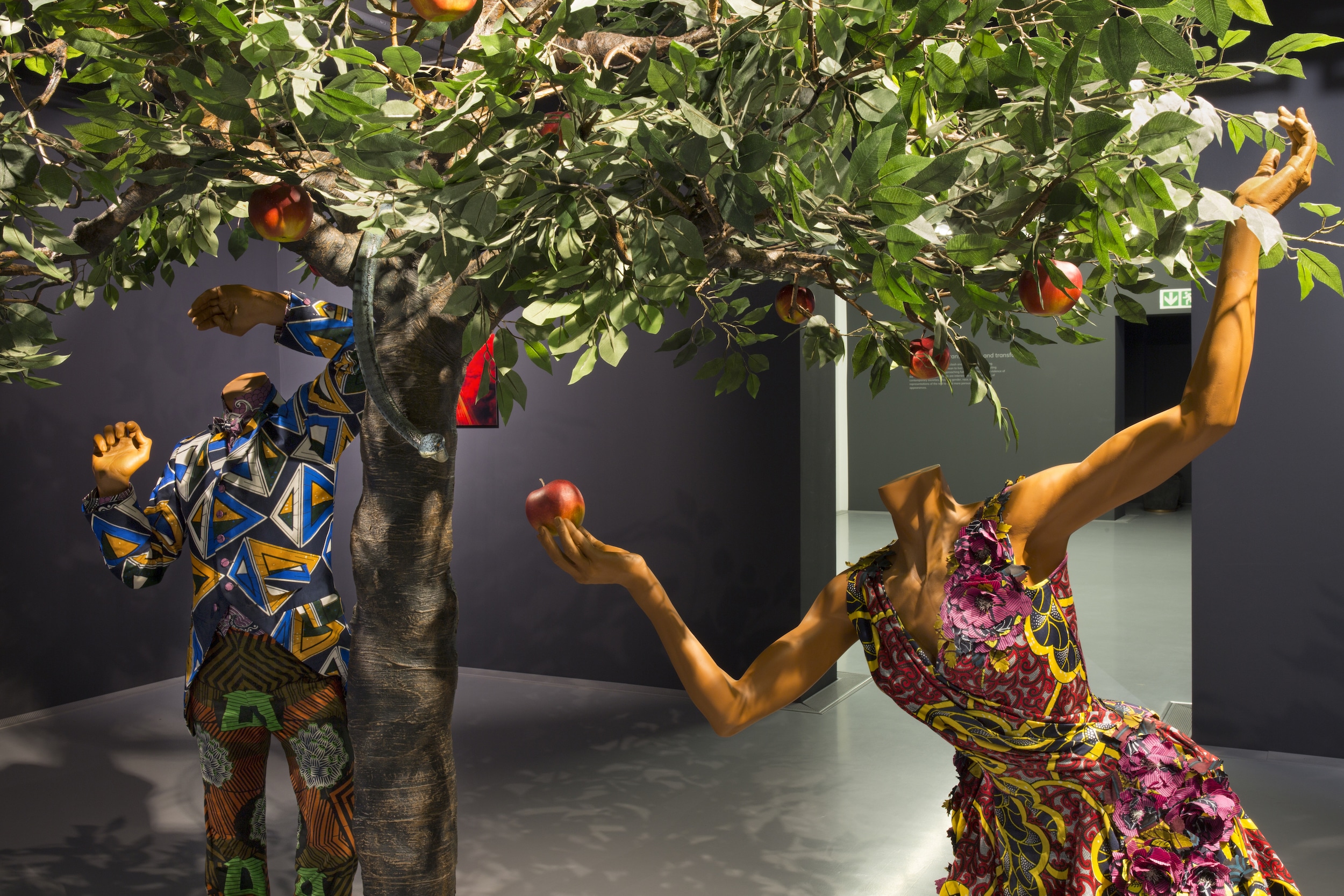 Yinka Shonibare, CBE. Adam and Eve. 2013. Fibreglass mannequins, Dutch wax printed cotton textile, fibreglass, wire, leather and steel baseplates. 285 x 230 x 115 cm. Installation view.
