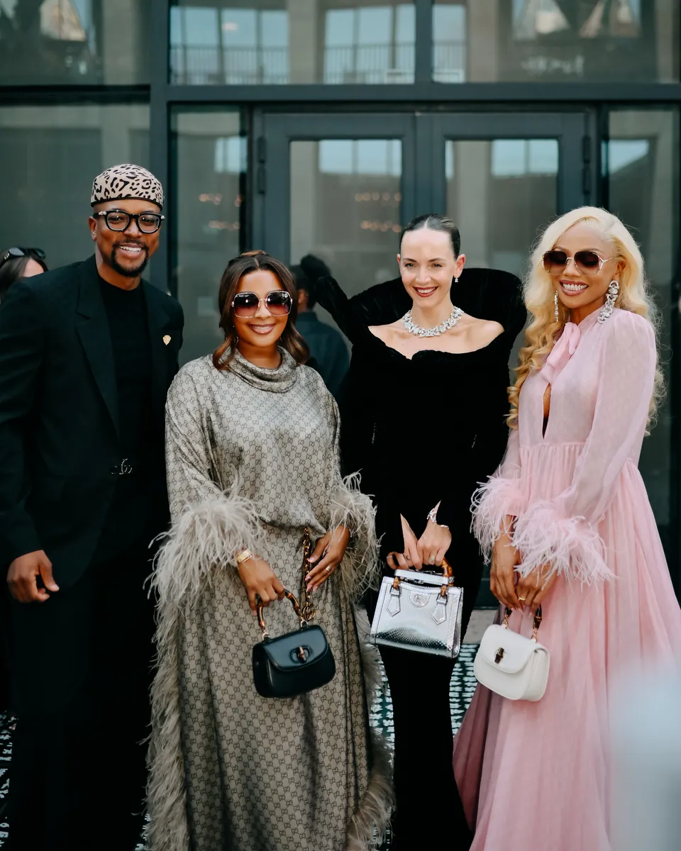 Four guests in evening wear posing together at the Zeitz MOCAA Gala